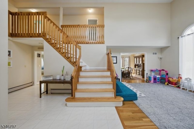 100 Toner Rd, Boonton Town, NJ 07005 - stairway featuring a towering ceiling, visible vents, and a baseboard radiator