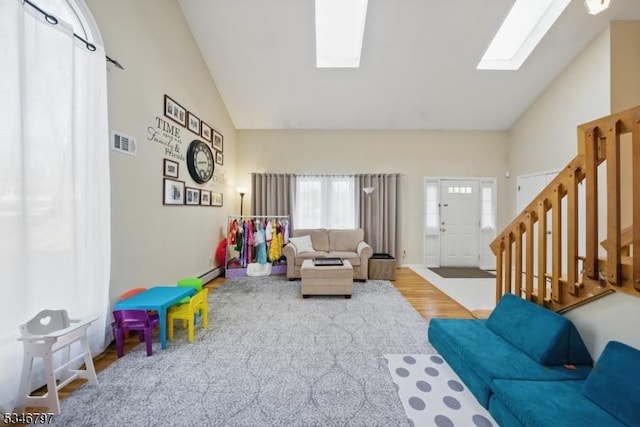 100 Toner Rd, Boonton Town, NJ 07005 - living room with stairs, high vaulted ceiling, a skylight, visible vents, and baseboard heating