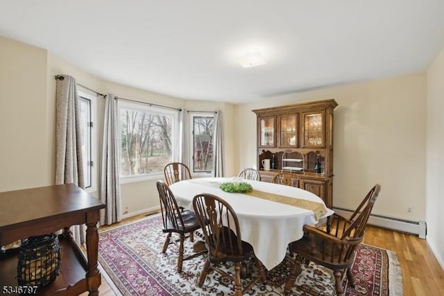 100 Toner Rd, Boonton Town, NJ 07005 - dining room featuring light wood finished floors and a baseboard radiator