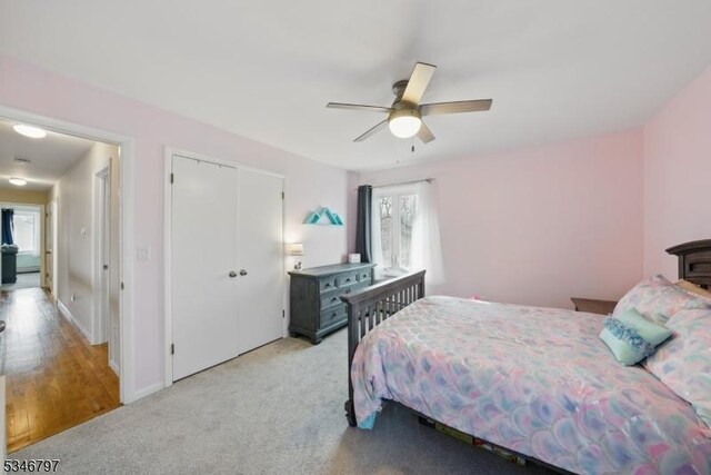 100 Toner Rd, Boonton Town, NJ 07005 - bedroom featuring baseboards, a closet, light colored carpet, and ceiling fan