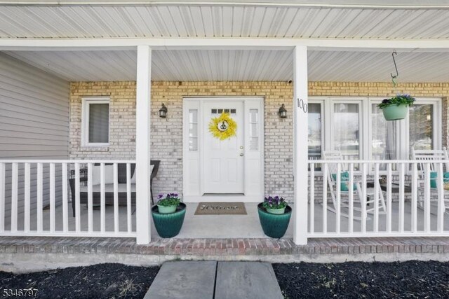 100 Toner Rd, Boonton Town, NJ 07005 - doorway to property with a porch and brick siding