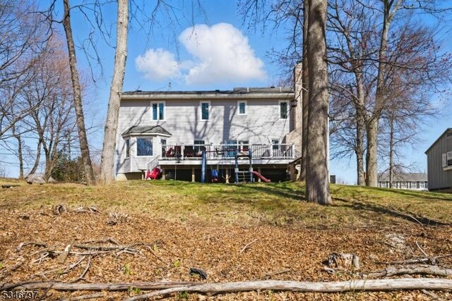100 Toner Rd, Boonton Town, NJ 07005 - rear view of house featuring a chimney and a wooden deck