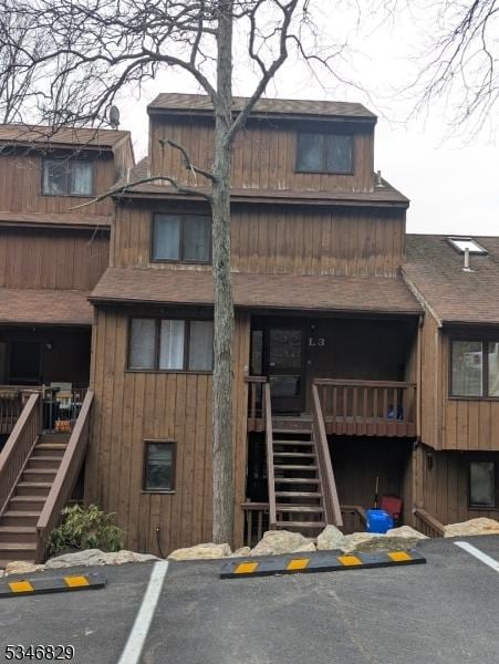 4 Village Way Unit 3, Vernon Twp, NJ 07462 - view of building exterior with stairway and uncovered parking