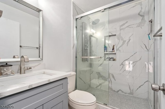 4 Village Way Unit 3, Vernon Twp, NJ 07462 - full bathroom with a marble finish shower, toilet, and vanity