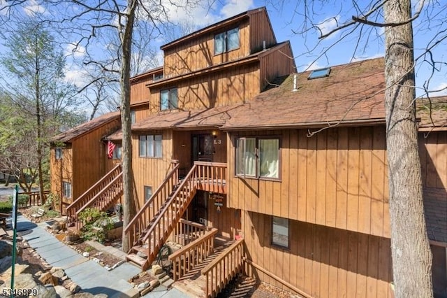 4 Village Way Unit 3, Vernon Twp, NJ 07462 - rustic home with stairway and roof with shingles