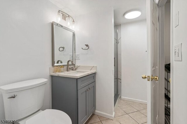 4 Village Way Unit 3, Vernon Twp, NJ 07462 - bathroom with a stall shower, tile patterned floors, toilet, vanity, and baseboards