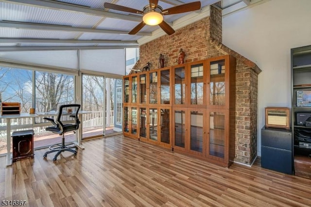 office area featuring ceiling fan, wood finished floors, and beam ceiling