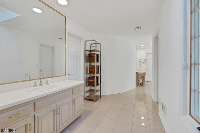 bathroom featuring visible vents, baseboards, tile patterned floors, recessed lighting, and vanity