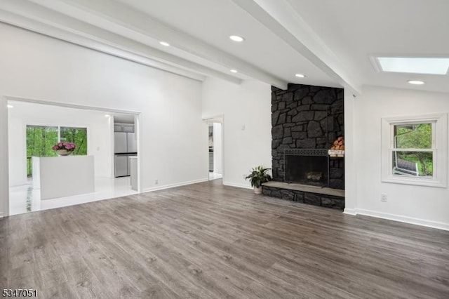 159 Musconetcong River Rd, Lebanon Twp, NJ 07882 - unfurnished living room featuring wood finished floors, a fireplace, a skylight, baseboards, and recessed lighting