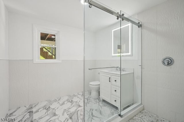 159 Musconetcong River Rd, Lebanon Twp, NJ 07882 - full bathroom with marble look tile flooring, a shower stall, vanity, toilet, and a wainscoted wall