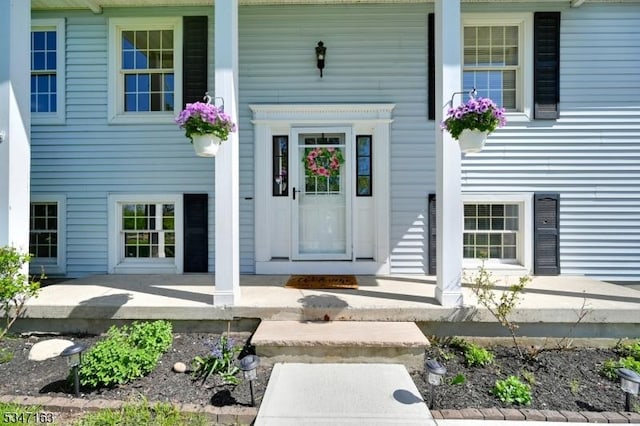 doorway to property with a porch