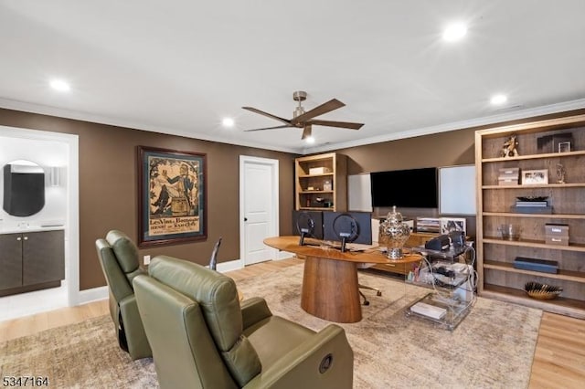 office area with recessed lighting, a ceiling fan, light wood-style flooring, ornamental molding, and baseboards