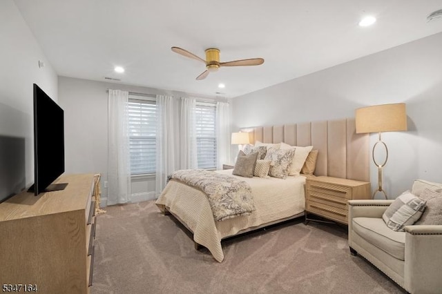 carpeted bedroom with ceiling fan and recessed lighting
