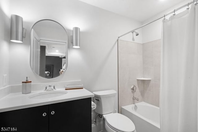 bathroom with vanity, shower / tub combo, and toilet