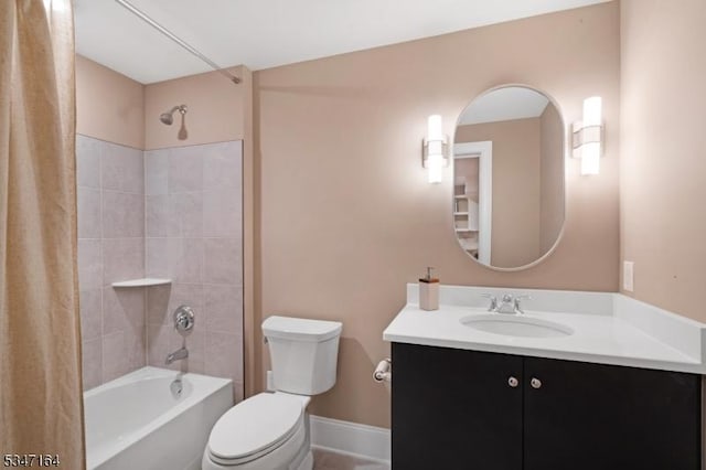 full bath with toilet, shower / bath combo with shower curtain, vanity, and baseboards