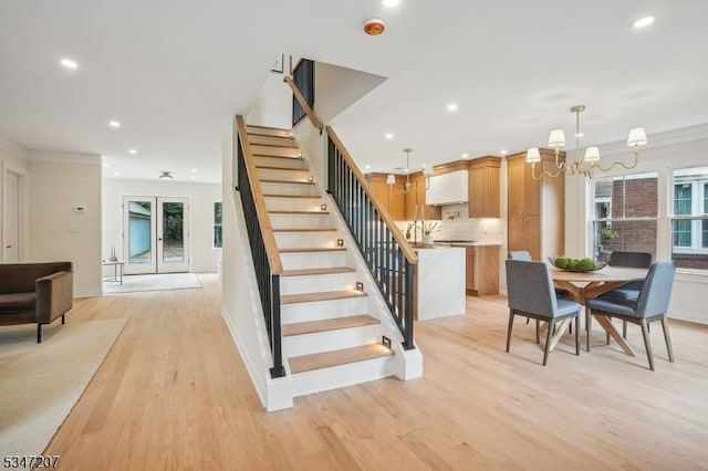 39 Walnut Cres, Montclair Twp, NJ 07042 - stairway with plenty of natural light, wood finished floors, recessed lighting, a chandelier, and baseboards