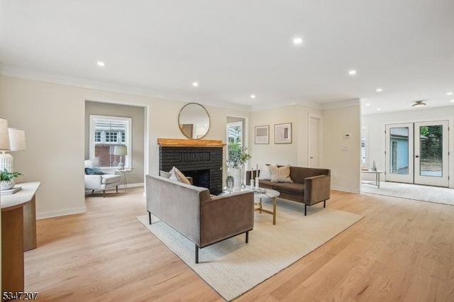 39 Walnut Cres, Montclair Twp, NJ 07042 - living area featuring healthy amount of natural light, recessed lighting, light wood-type flooring, a brick fireplace, and crown molding