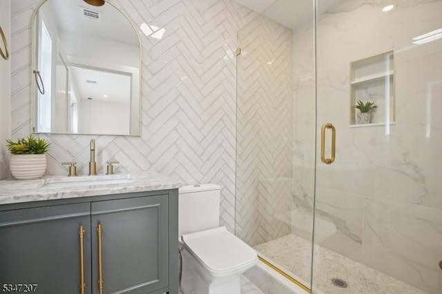 39 Walnut Cres, Montclair Twp, NJ 07042 - bathroom with toilet, vanity, a shower stall, and tile walls