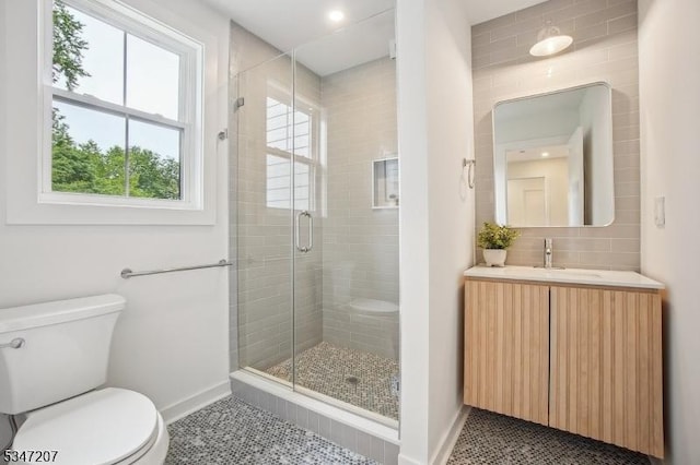 39 Walnut Cres, Montclair Twp, NJ 07042 - full bathroom with toilet, baseboards, vanity, a shower stall, and tasteful backsplash