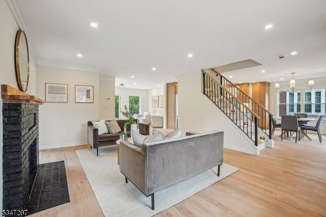 39 Walnut Cres, Montclair Twp, NJ 07042 - living room featuring light wood-style floors, stairway, crown molding, recessed lighting, and a fireplace