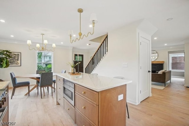 39 Walnut Cres, Montclair Twp, NJ 07042 - kitchen with a chandelier, stainless steel microwave, light wood-type flooring, healthy amount of natural light, and recessed lighting