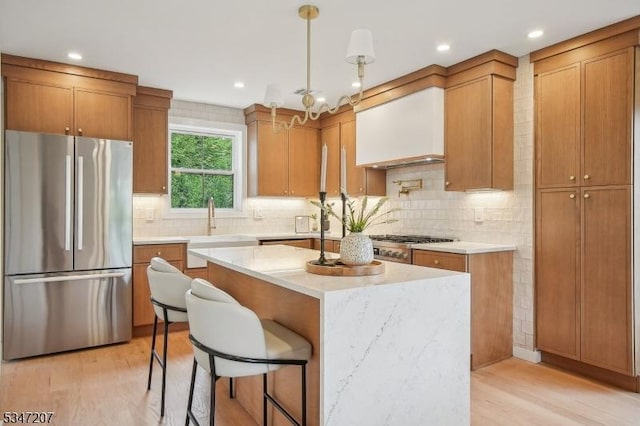 39 Walnut Cres, Montclair Twp, NJ 07042 - kitchen with freestanding refrigerator, a sink, light wood-type flooring, a center island, and recessed lighting
