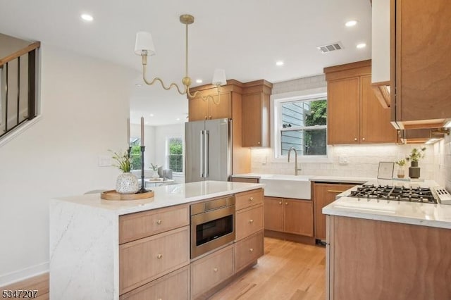 39 Walnut Cres, Montclair Twp, NJ 07042 - kitchen with stainless steel appliances, a sink, decorative backsplash, recessed lighting, and light wood-type flooring