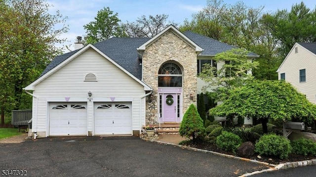 19 Trails End Ct, Westfield Town, NJ 07090 - traditional-style home featuring stone siding, asphalt driveway, an attached garage, and a chimney