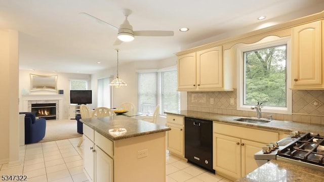 19 Trails End Ct, Westfield Town, NJ 07090 - kitchen featuring black dishwasher, a sink, cream cabinetry, a kitchen island, and light tile patterned flooring