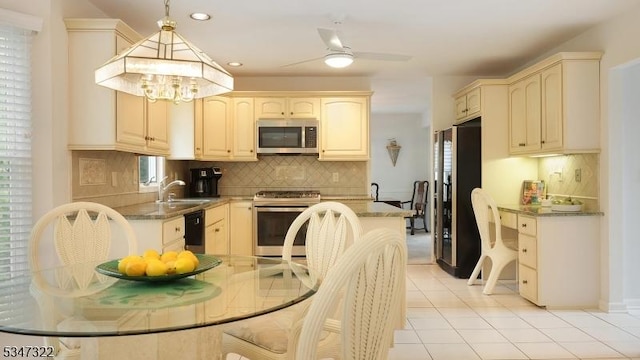 19 Trails End Ct, Westfield Town, NJ 07090 - kitchen featuring stainless steel appliances, a sink, decorative backsplash, light tile patterned floors, and ceiling fan