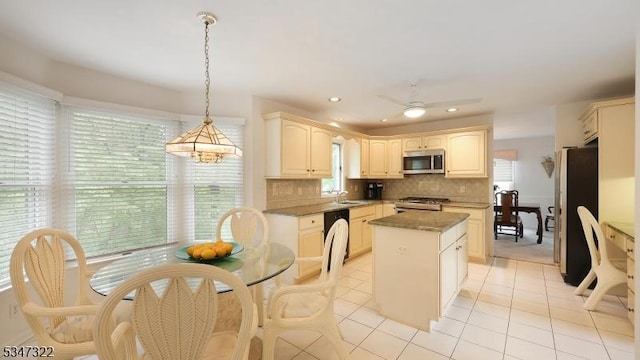 19 Trails End Ct, Westfield Town, NJ 07090 - kitchen featuring stainless steel appliances, a center island, a sink, light tile patterned floors, and decorative backsplash