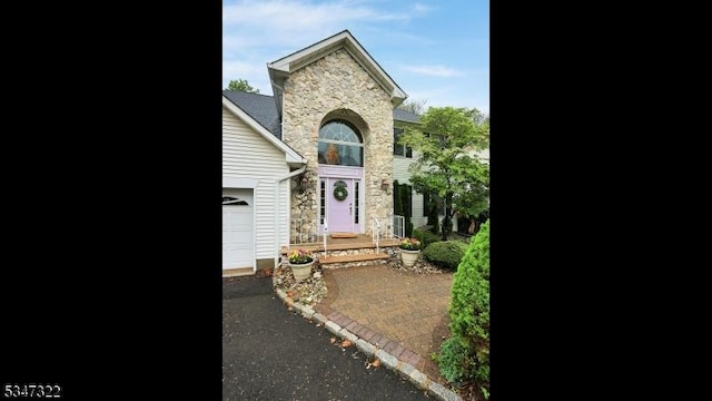 19 Trails End Ct, Westfield Town, NJ 07090 - traditional-style house with stone siding and an attached garage