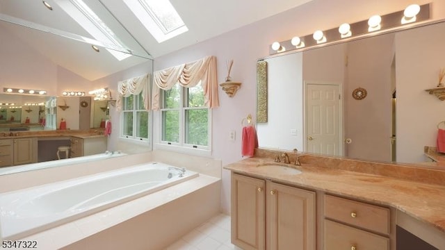 19 Trails End Ct, Westfield Town, NJ 07090 - bathroom featuring a skylight, vaulted ceiling, a bath, vanity, and tile patterned flooring