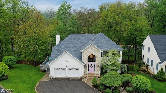 19 Trails End Ct, Westfield Town, NJ 07090 - traditional home with a garage, a chimney, driveway, stone siding, and roof with shingles