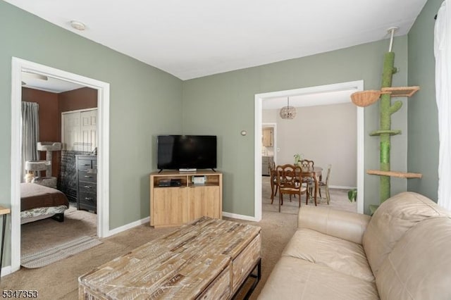 living area with carpet floors and baseboards
