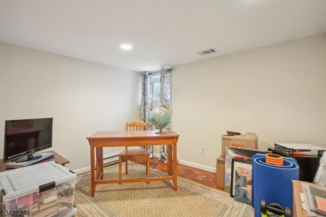 home office with wood finished floors, recessed lighting, baseboards, and visible vents