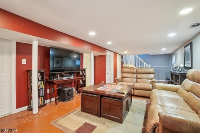 living room featuring baseboards, recessed lighting, visible vents, and stairway