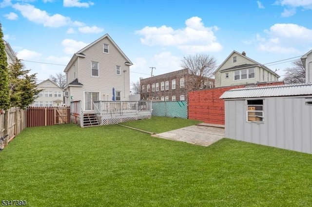 view of yard featuring a fenced backyard and a deck