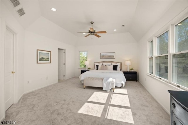 bedroom featuring visible vents, light carpet, and vaulted ceiling