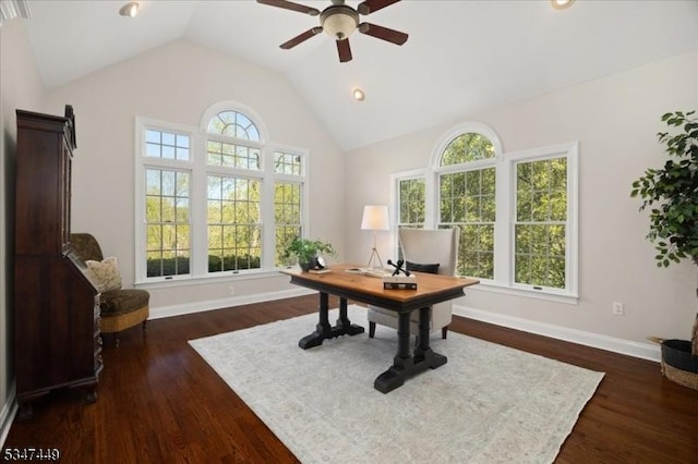 home office with baseboards, ceiling fan, dark wood-style floors, and high vaulted ceiling