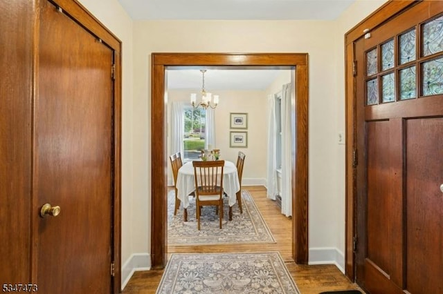 577-9 Greenbrook Rd, North Plainfield Boro, NJ 07063 - entrance foyer with a chandelier, wood finished floors, and baseboards