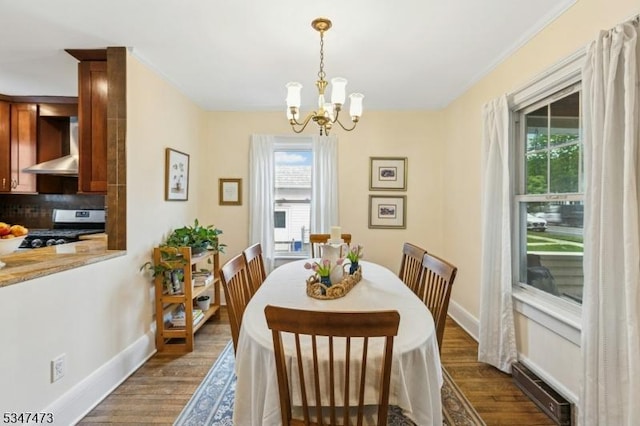 577-9 Greenbrook Rd, North Plainfield Boro, NJ 07063 - dining room featuring dark wood-style flooring, a chandelier, healthy amount of natural light, baseboards, and ornamental molding