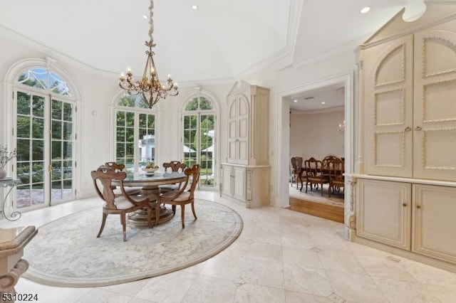 dining area with a chandelier, ornamental molding, plenty of natural light, and recessed lighting