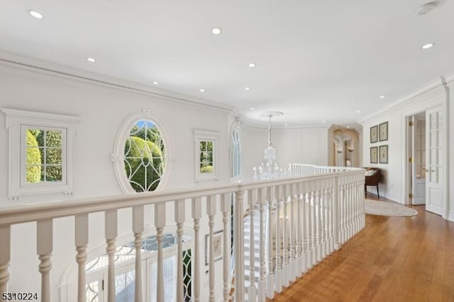 hallway featuring ornamental molding, recessed lighting, and wood finished floors