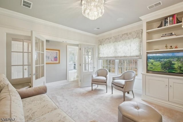 living area featuring a notable chandelier, ornamental molding, french doors, and visible vents
