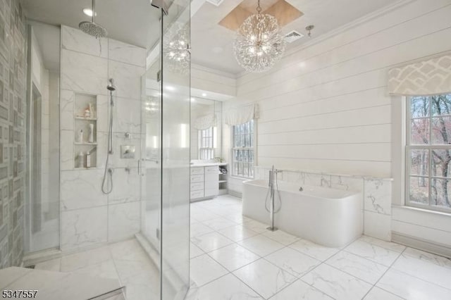 full bathroom with visible vents, a marble finish shower, crown molding, a soaking tub, and a notable chandelier