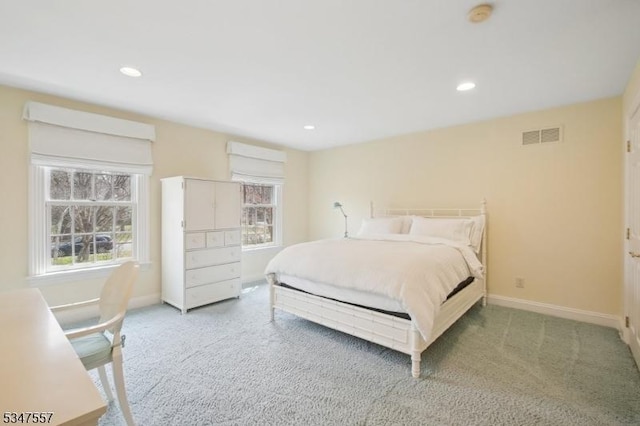 carpeted bedroom featuring baseboards, visible vents, and recessed lighting