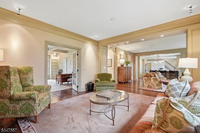 living room featuring recessed lighting, wood finished floors, french doors, crown molding, and baseboards