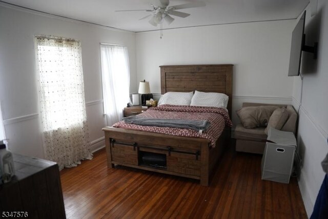 bedroom featuring a ceiling fan and wood finished floors