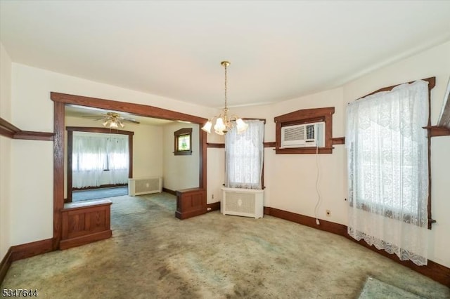 unfurnished dining area featuring a chandelier, baseboards, carpet floors, and cooling unit